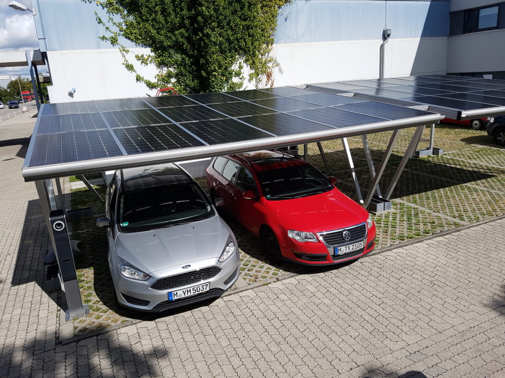 Photovoltaic carport system with transparent solar modules