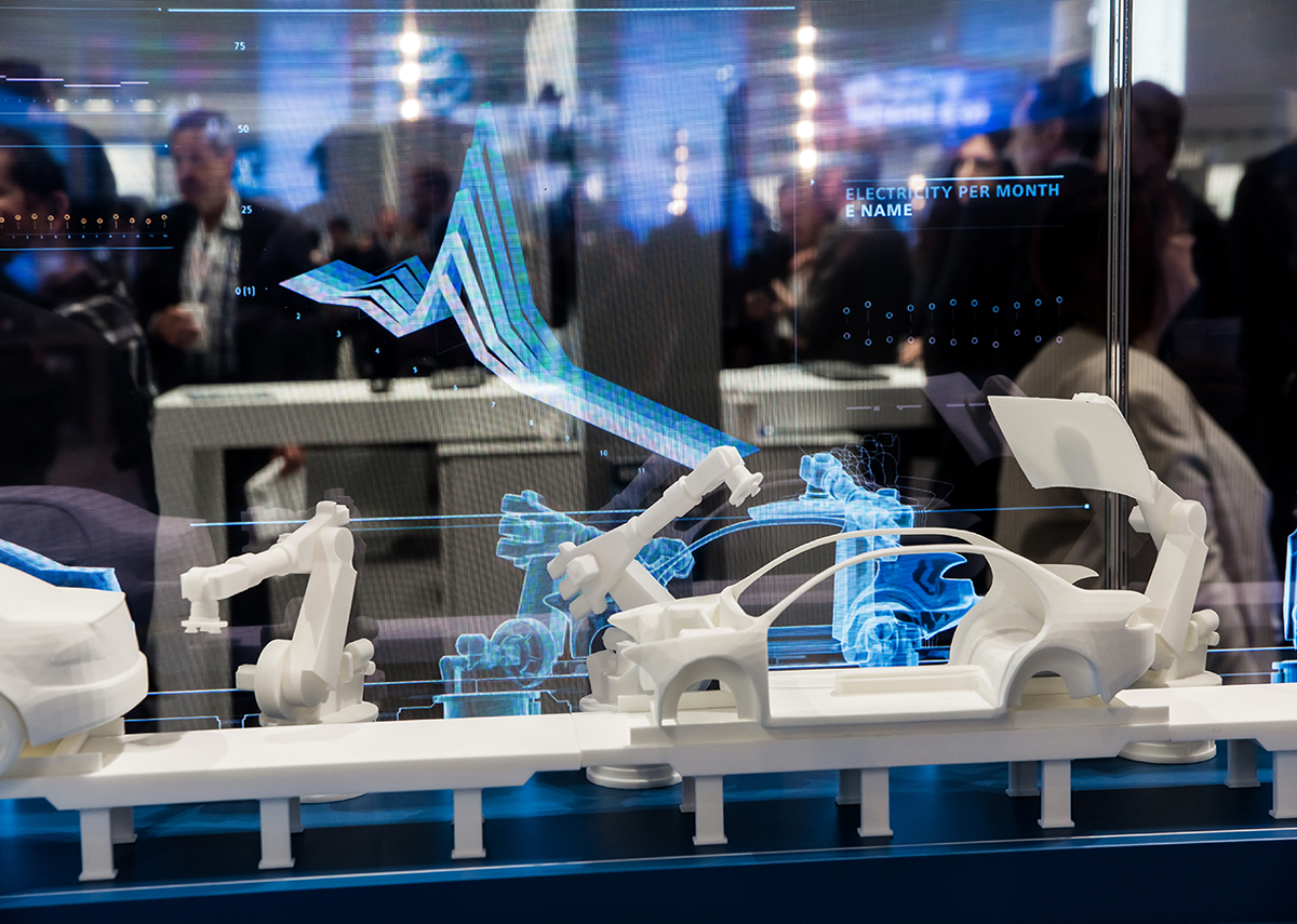 Messe in Hannover: Automobilfertigung mit Roboter und digitalem Zwilling als Simulation auf dem Siemens-Stand